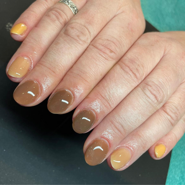Brown and yellow client nails using Pure Nails' Halo builder gel in shade 'Eclair' 